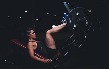 Woman doning leg press